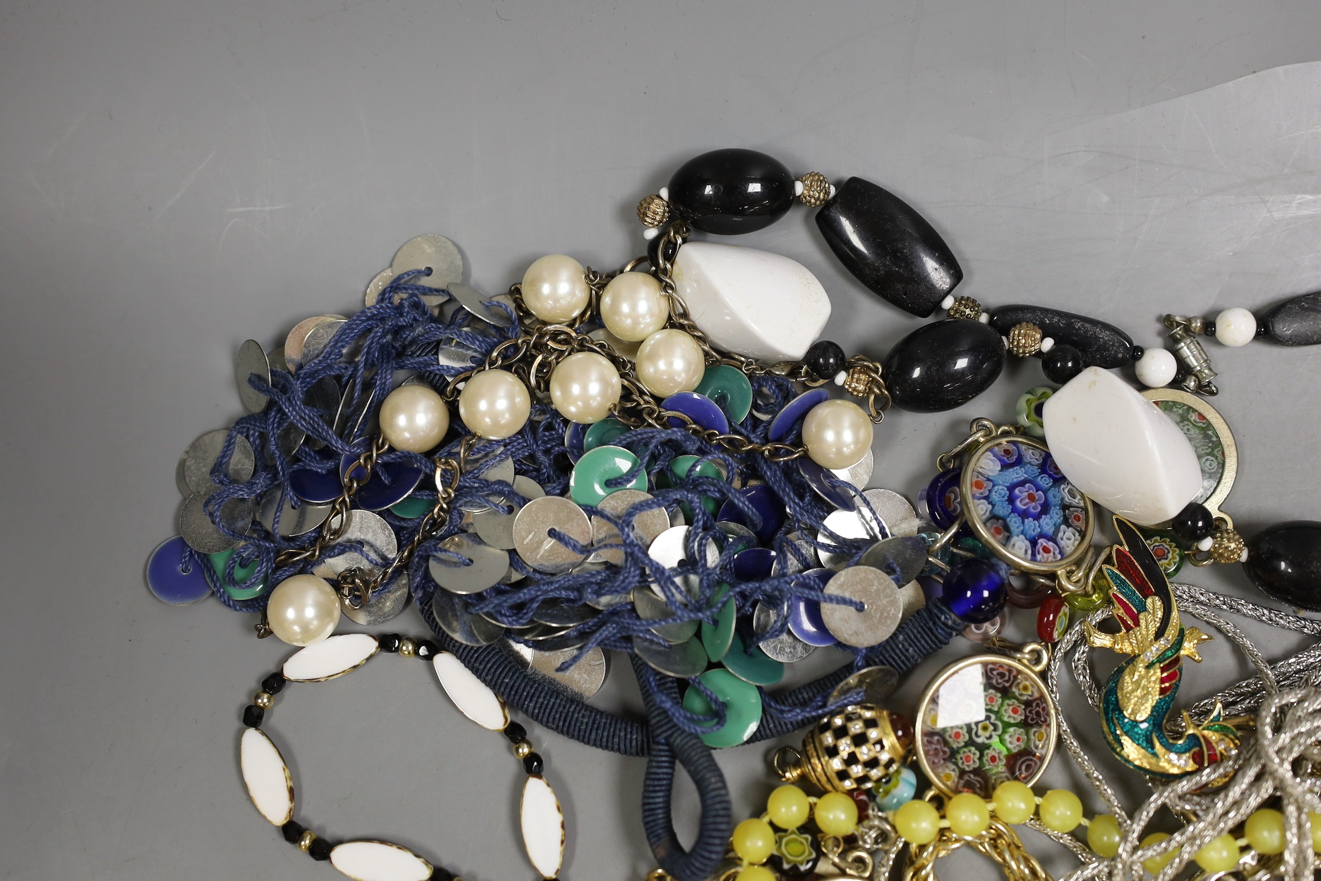 A quantity of assorted costume jewellery including necklaces, bracelets etc.